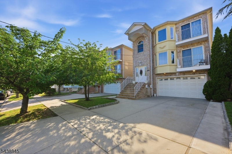 Exceptional Newer Construction Two-Family in the Highly Sought-After Elmora Section of Elizabeth!This beautifully designed income-producing property offers the perfect blend of luxury, comfort, and convenience. Situated on a 35x102 lot, this home features 6 bedrooms, 5 full bathrooms, and a fully finished walkout ground level offering endless possibilities.Each unit boasts a bright open-concept layout with 3 spacious bedrooms, 2 full bathrooms including a primary suite, dedicated laundry room, private balcony, modern kitchen with stainless steel appliances, hardwood floors, premium Andersen windows, and central heating & cooling. Complete with an oversized attached garage, a wide driveway, and a prime location close to NYC transportation, schools, shopping, and dining. A rare opportunity for both owner-occupants and investors alike. Low taxes!