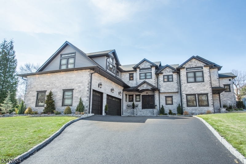 This newly constructed stately home blends custom details w exquisite finishes. Its unique layout boasts grand open spaces perfect for gatherings, while maintaining a cozy, relaxed ambiance for everyday living. Step through the central foyer, into a chef's kitchen that dreams are made of. Custom cabinets, high-end appliances, a walk-in pantry, & an oversized island create a culinary haven that flows into the open dining room & family room where you can savor breathtaking sunset vistas over the lush private lawn. Panoramic windows bathe the gracious living room in sunlight while multiple outdoor patios beckon for al fresco dining & celebrations. A secluded home office provides a tranquil workspace, & two staircases ensure a perfect circular flow. Ascend to the main wing, where the primary bedroom awaits w soaring ceilings, a WIC & a luxurious spa-like bath featuring heated flrs, a soaking tub & a walk-in shower for two. Two add'l bedrms share an elegant Jack & Jill bath, while a separate wing offers guests a spacious bedroom w an ensuite bath & an adjacent cozy den or fifth bedrm w another private bath. Convenience is key w a stylish laundry room & dedicated pet spa. The expansive bsmnt offers endless possibilities for fitness, wine storage or game-day gatherings. An oversized three-car garage adds the final touch of luxury. Perfectly situated to enjoy the highly rated West Essex schools, parks, town pool, shops & restaurants, this home is sanctuary where memories are made.
