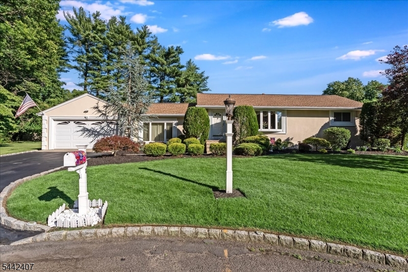 Welcome home to this charming, meticulously maintained 3 bedroom ranch, offered for the first time in 40 years.  Filled with warmth and pride of ownership, this special home features hardwood floors under the beautiful wall to wall carpet, an updated kitchen with stainless steel appliances, a spacious living room/dining room, and a welcoming den with a wood burning fireplace.  The fully finished lower level offers exceptional additional living space, complete with an expansive recreation area, wet bar, full bath, ceramic tiled floor  - perfect for entertaining or a possible mother-daughter opportunity.   Currently configured to suit the owners' lifestyle, two of the three bedrooms are being enjoyed as a sitting room and an office.  Both can easily be converted back to bedrooms.  Nestled on a quiet cul-de-sac, this home sits on a gorgeous, level, almost 1/2 acre lot with beautifully landscaped grounds, a spacious patio with firepit, creating the ideal setting for outdoor enjoyment.  Additional features include central AC, gas HWBB heat, an oversized two-car garage, a security system, underground sprinkler system, a full house water filtration system, and a convenient location close to shopping, dining, parks and major commuting routes.  This is a truly special opportunity to own a lovingly cared-for home in a wonderful neighborhood - don't miss your chance to make it your own!  It won't last!