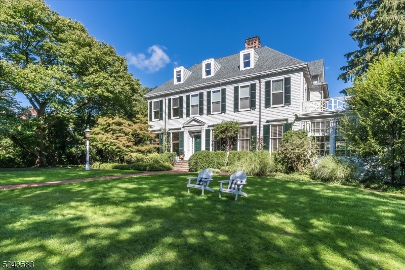 Welcome to your "country" house, nestled on over an acre of property just 15 miles from NYC and 4 blocks from Montclair's trendy downtown, bursting with life and culture. Spend your days amid the lush sprawling landscape of this unique home, a delightful fusion of modern comfort and historic charm. The captivating entry sets the tone for the elegance and serenity within. The spacious living areas are bathed in natural light, with large floor to ceiling windows that allow for a seamless connection between the indoors and out and create a sense of ease and warmth. Countless built-ins adorn the familyroom and 1st fl office. The heart of the home is a gourmet kitchen that combines the charm of the English countryside with the convenience of modern functionality. Stone countertops, a large center island and ample cabinets provide a ideal blend of aesthetics and practicality. A 6-burner Wolf range, SubZero refrigerator and high-end appliances cater to the demands of today's chef, while an ingeniously designed cellar will suit the wine connoisseur. This expansive home offers 7 bedrooms (5 w/ensuite baths), including a tranquil primary ensuite with separate dressing area. Now, step outside, where the magic truly comes to life. The porch, patio, and heated gunnite pool offer the perfect setting for your most cherished gatherings. All this on 1.17 acres PLUS a 3 car garage with a lovely income producing 2-bedroom carriage house apartment above. Your wait is over.