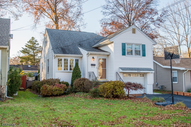 Commuter location! Charming split level situated in Lake Hiawatha just minutes from major hwys and NYC Direct public transportation. Tons of Versatile Living Space! Recent upgrades & features include new sump pump, furnace, tankless hot water heater, Anderson windows, HW floors, crown molding & recessed lighting throughout! Central Air, natural gas, public water, sewer, generator hookup & much more! 1st floor offers formal LR w/bright bay window & EiK w/granite counters & modern black appliances. 2 BDRMs on 2nd floor + Full Bath & 3rd BDRM on 3rd w/ walk up attic. Oversized FR w/ bath, laundry, garage access & a walkout to covered patio. Level fenced in yard for play & relaxation. Situated on a dead end street in a lovely neighborhood by Volunteer's Park & close proximity to town center. Top Schools!