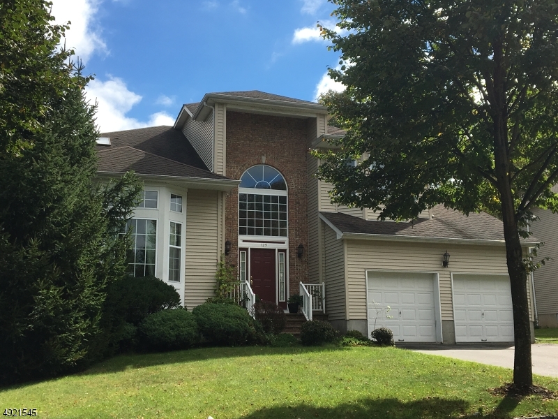 EXCEPTIONALLY SPACIOUS 4 BR, 2.1 BATH COLONIAL IN DESIRABLE POETS PEAK. ENTER IN THE 2 STORY GRAND FOYER, VAULTED CEILING IN LR, DECORATIVE COLUMNS & WAINSCOTING IN FORMAL DR. KITCHEN FEATURES CENTER ISLAND W/4 BURNER/GRILL, PLUS DOUBLE OVEN, CORIAN COUNTERTOPS, MAPLE CABINETS AND SKYLIGHTS IN EATING AREA.  FR OFFERS WOODBURNING FP. CUSTOM CLOSETS THROUGHOUT, MASTER BR W/LARGE WALK-IN CLOSET, SOAKING/JETTED TUB, DOUBLE VANITY.  THE BEAUTIFULLY FULL FINISHED BASEMENT IS VERY SPACIOUS AND MAKES THE PERFECT REC ROOM. IT ALSO HAS PLENTY OF STORAGE SPACE & A  14X11 FINISHED AREA THAT CAN BE USED FOR A HOME OFFICE OR EXERCISE ROOM.  NICELY LANDSCAPED WITH A PAVER PATIO AND HOT TUB IN THE VERY PRIVATE, FENCED-IN BACK YARD.  ALL PUBLIC UTILITIES HERE!