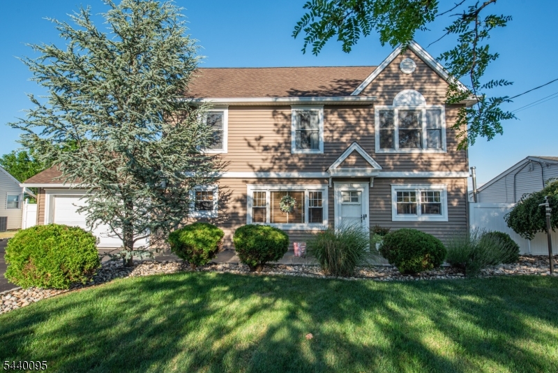 Welcome home to this beautifully updated Colonial that perfectly balances classic architectural charm with modern conveniences. From the moment you step onto the timeless hardwood floors, you will feel the warmth and care that flows through every room of this pristine property. The heart of the home features a brilliantly updated kitchen, complete with rich granite countertops and sleek stainless steel appliances, flowing effortlessly into the inviting living spaces. Upstairs, the primary suite serves as a true retreat, featuring a generous walk-in closet and its own private, attached en-suite bathroom. For ultimate convenience, the dedicated laundry room is also located on the second floor near the bedrooms. The outdoor living space is equally impressive, offering a fantastic covered patio perfect for dining, alongside a massive, fully fenced backyard with plenty of room. An attached one-car garage completes this exceptional property, providing protection from the elements and extra storage. With its classic silhouette, beautiful wood floors, and smart, functional updates, this home is completely move-in ready.