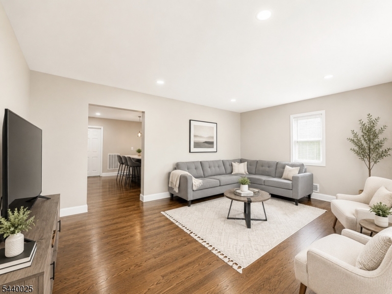Beautifully renovated 1st-floor unit in a well-maintained two-family home! This spacious apartment features a living room, kitchen, and dining area, 2 bedrooms plus a bonus room ideal for a home office or guest space, 1 full bath, and ample storage throughout. Enjoy hardwood floors, stainless steel appliances, and backyard access. Conveniently located near public transportation, restaurants, shopping, and major roadways. Rent includes water, taxes, snow removal, and backyard use. A must-see! ***Credit report and full background check is a required