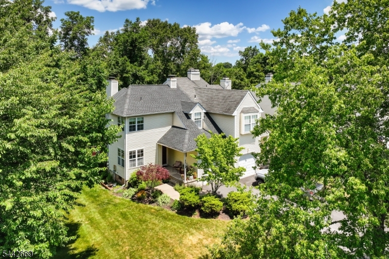 Meticulous craftsmanship defines turn-key end unit home with 2 Bedrooms & a possible 3rd in the Basement (w/egress windows). New Roof & skylights (2025), New Furnace & A/C (2025), wood floors & freshly painted throughout & Finished Basement are just a few of the attractive features here, located in desirable Winding Ridge/Old Towne Community. Curb appeal welcomes you w/ a front porch surrounded by gorgeous gardens, new driveway & the privacy of a end unit, backed by woods. The stylish renovated Eat-in kitchen showcases custom cabinetry, quartz countertops, stainless steel appliances (microwave 2025) & water filter. The open floor concept seamlessly merges the formal dining & elegant living room offering a wood-burning fireplace & vaulted ceilings w/skylights, making a perfect setting for entertaining and contains french door to the perfectly serene outside deck. The laundry w/Newer Washer& Dryer (approx.10yrs old), updated powder room & access to 1 car garage finish off the 1st level. 2nd level boasts the same gorgeous wood floors& fresh paint- Primary Bedroom suite offers a walk-in closet & a full bath featuring jetted tub & stall shower. Another ample Bedroom w/2 closets & another full bathroom are found upstairs. Finished basement comes complete w/a rec area, now used as a guest area (could be a 3rd Bedrm) & a large storage space. Step outside onto the elevated deck to enjoy a gorgeous wooded scenic yard- private and serene are in abundance here.