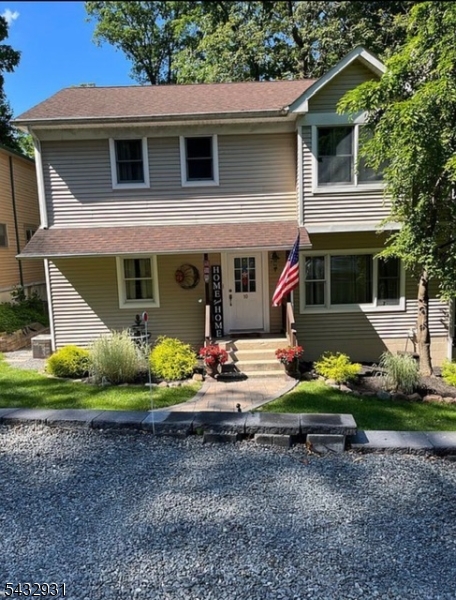 Beautiful large custom home offering year-round lake views and versatile living space throughout. Main level features a bright open-concept layout with a spacious kitchen overlooking the living room, creating a perfect setting for everyday living and entertaining. A formal dining room overlooks the backyard and offers sliding-door access to a wonderful oversized deck, ideal for relaxing, dining outdoors. Walking distance to 2nd beach w/boat storage and playground. The first floor also includes a bedroom and a full bathroom, providing convenient one-level living options. Upstairs, you will find three generously sized bedrooms and a full bath, offering plenty of space for guests, or a home office.The ground level is a standout feature, offering an in-law suite/apartment with a private entrance-this separate living area includes a bedroom, full bath, kitchenette, and living room. Set against a beautiful backyard with scenic lake views, this home combines comfort, space, and functionality in a truly special setting. Enjoy all the benefits of private lake community living, including swimming, fishing, BOAting, ice skating, swim team, clubhouse rentals, and seasonal events. Just a few miles away, outdoor enthusiasts can explore hiking/camping at Mahlon Dickerson Reservation. Conveniently located near major highways and public transportation to NYC and Just minutes from NJ?s largest lake, Lake Hopatcong offering even more opportunities for boating, waterfront dining and recreation.