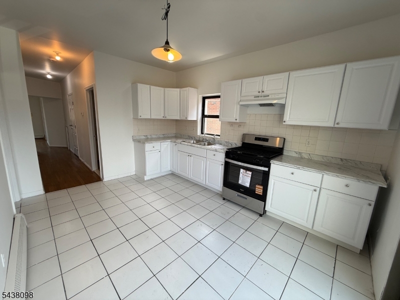 Welcome to this well-maintained 3-bedroom, 1-bath apartment in Newark. This bright and inviting unit features high ceilings, generous closet space, and abundant natural light throughout. The large eat-in kitchen offers ample cabinet and counter space and opens to a private balcony, perfect for enjoying your morning coffee or fresh air. Updated full bathroom, freshly painted interior, and move-in ready condition. Conveniently located near shopping, restaurants, schools, public transportation, and major highways for an easy commute. Available immediately. Parking available for an extra fee.