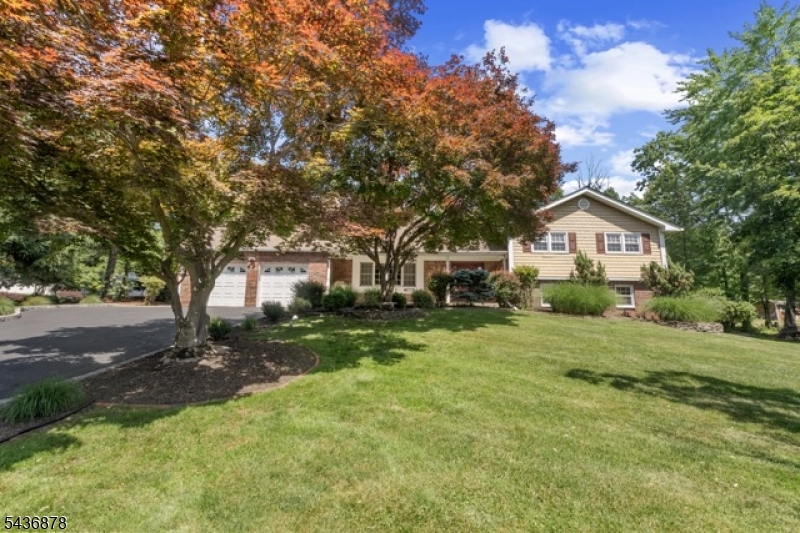 Nestled on a beautiful, park-like .76-acre property in one of Montville's most desirable neighborhoods, this warm and inviting Split offers the perfect blend of comfort, space, and charm. The moment you arrive, you'll appreciate the peaceful setting, mature landscaping, and sense of privacy that make this home truly special. Featuring 4 spacious Bedrooms, 2 FBs, and 2 HBs, this home offers plenty of room for both everyday living and entertaining. Natural light fills the home, creating a welcoming atmosphere throughout, while the thoughtful designed floor plan allows for easy customization and future expansion. Whether you're hosting holidays or special occasions, enjoying cozy evenings by the fire, or entertaining guests, the generous layout offers comfort and relaxation, making it ideal to accommodate large gatherings. Step outside onto a 1000 sq. ft. patio and discover a backyard setting that invites relaxation, outdoor dining, and endless possibilities for recreation. Ideally located near top-rated schools, parks, shopping, dining, and major highways, this exceptional home offers the perfect balance of privacy and convenience. Beyond its spacious layout, beautiful setting, and timeless appeal, this home offers the peace of mind today's buyers are looking for. The roof is 5 years old and includes a transferable warranty. Numerous additional upgrades and updates have been made throughout the home, reflecting the care and pride of ownership that is evident throughout.