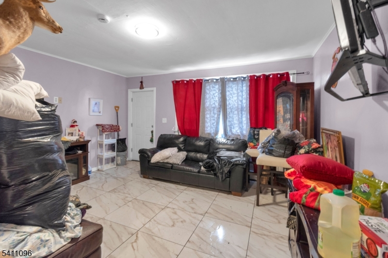 Fully Renovated 3-Story home, newly painted and tile throughout. 3 bedroom, 1 bath, FULL basement, large backyard. Convenient access to NJ Transit bus and train lines ensures easy travel to Downtown Newark and NYC. A great opportunity to own a solid multifamily in one of Newark's most accessible locations. Seller concessions available, not sold as is, seller will obtain certificate of occupancy and city/state requirements.
