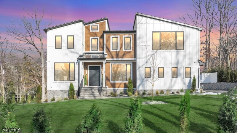 Nestled on a peaceful cul-de-sac in the desirable section of Short Hills, this modern new construction  residence seamlessly combines elegance, warmth, and state-of-the-art amenities. The backyard is a private oasis, complete with a stunning gunite smart saltwater pool, covered porch, private balcony & a generous deck surrounded by lush landscaping. 1 Barry exudes refined style with soaring 20ft ceilings,  oak hardwood flooring, and custom modern doors. The European custom  expansive windows allows natural light to flood the open-concept living spaces. The  premier gourmet kitchen features designer light fixtures, 13ft marble island, custom white oak cabinetry, and Thermidor appliances, including double ovens and a massive sized refrigerator. The separate prep kitchen features a  Thermador fridge & microwave/oven combo. The home offers 7 spacious bedrooms, each with its own luxurious en-suite bathroom and unique accent walls. The primary suite serves as a personal retreat with a cozy lounge, private balcony & a spa-inspired bathroom. The fully finished entertainment  level includes 9ft ceilings,  a family room with a fireplace, a second kitchen with a smart fridge, a secondary laundry room, and en-suite accommodations. Outfitted with an advanced security system, Legrand  outlets,  robust 300-amp electrical system, EV charger & Bluetooth connectivity  this home provides unparalleled convenience, security & privacy in one of Short Hills' most coveted locations.