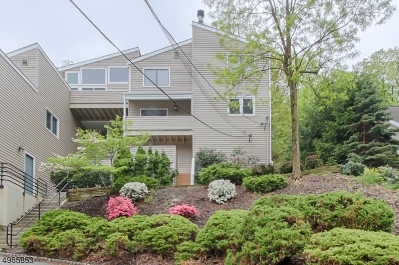 Brand new Goodman HVAC system Beautifully maintained multi level townhouse in a quiet setting, but still walk to town. Updated master bath has a soaking tub, granite sink and custom tile work. Newer patio doors and custom windows throughout. 2 parking spots deeded to this unit w attached garage. Master has great natural light. Second Bedroom has private deck with amazing views. Chefs kitchen features ss appliances, custom lighting and open concept to the dinning room w crown molding and slider to lower level deck. bonus room off kitchen has endless options
