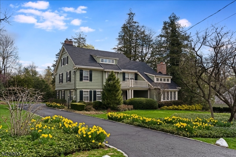 This distinguished residence is set on an exceptional 1.02-acre level lot in the heart of Old Short Hills, offering a serene and private setting within the highly sought-after Glenwood section. Featuring 6 bedrooms and 4.1 baths, the home offers a well-designed and versatile floor plan. A spacious and inviting family room welcomes you at the front of the home, complemented by elegant formal living and dining rooms, ideal for both everyday living and entertaining. The existing footprint provides the perfect opportunity to design your dream kitchen, or dream big and take full advantage of the expansive property to create a custom dream home. The second floor hosts 4 generously sized bedrooms and 3 bathrooms, while the third floor offers two additional bedrooms and another full bath, ideal for a private guest suite, home office, or flexible living space. Lovingly maintained over the years, the home features updated HVAC systems, a newer roof (2018), and numerous thoughtful improvements throughout. House being sold in AS IS condition.