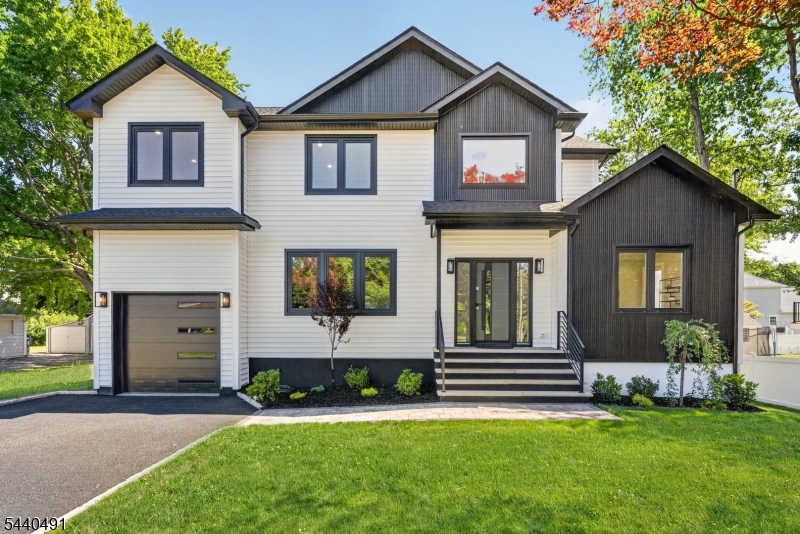 One-of-a-kind new construction built on an existing foundation, thoughtfully designed with today's lifestyle in mind. This stunning 5-bedroom, 3.5-bath home features 9-foot ceilings on the first floor, creating an open and airy atmosphere throughout. Sun-drenched living spaces are enhanced by oversized luxury windows and beautiful hardwood flooring on both levels.The gourmet kitchen flows seamlessly into the main living and dining areas, making it ideal for both everyday living and entertaining. Luxurious finishes can be found throughout, including heated bathroom floors for added comfort and convenience.Retreat to the expansive primary suite, offering a private sanctuary with a spa-inspired bath and generous closet space. With spacious bedrooms, modern design, and exceptional craftsmanship throughout, this home delivers the perfect blend of elegance, comfort, and functionality.A rare opportunity to own a truly exceptional new construction home