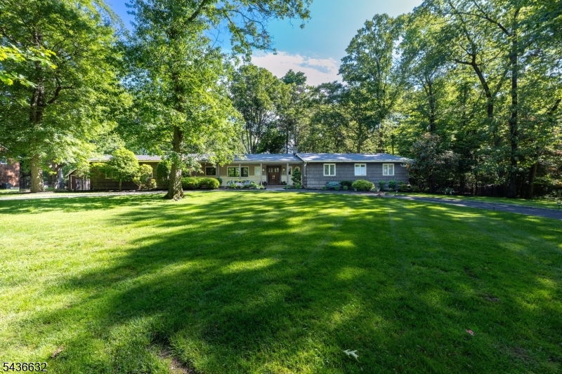 Expansive ranch on a private cul de sac in one of Scotch Plains' most sought after neighborhoods. This stunning 3 bed, 3 full and 2 half bath home offers over 2,600 sqft of beautifully appointed living space and is truly made for entertaining. Step inside to a marble entry that leads to the living room with soaring beamed cathedral ceilings. The spacious formal dining room, eat in kitchen, and living room are perfect for hosting holiday gatherings and entertaining. A sun filled family room with gas fireplace completes the main level, with four sliders opening to nearly one acre of fully fenced professionally landscaped grounds featuring a large patio and built in grill. The large primary suite includes a private en-suite bath. The fourth bedroom was converted to a wonderful California Closet room attached to the primary and can easily be converted back. An additional bedroom also enjoys its own full bath. The fully finished lower level offers incredible bonus space to organize however you see fit, whether that is a recreation room, home office, or extra storage, complete with a cedar closet and half bath. Additional highlights include a whole home generator, a 3 year old roof and an EV charger. All of this in the heart of Scotch Plains, home to a well regarded school system, a charming downtown with shops & restaurants, & convenient access to major highways and NJ Transit for an easy commute.