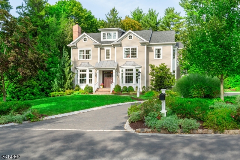 Welcome to this stunning transitional newer construction home combining classic charm with modern elegance, located in the coveted Rolling Hill neighborhood on a quiet and level lot. This spectacular residence, crafted by premier builder DeMarzo & Sons, features 3 finished floors as well as an unfinished walk-up attic with mulitple rooms and a pre-plumbed bath, offering endless possibilities. Step into the grand foyer flanked by a fireside formal living room and a formal dining room with convenient butler's pantry, showcasing exquisite custom millwork throughout. The heart of the home is the expansive kitchen and family room. The kitchen boasts white shaker-style cabinets, marble and granite countertops, and top-of-the-line appliances, with a wide breakfast room seamlessly connecting to the patio and yard through elegant French doors. The sunlit family room features a wall of windows and a cozy fireplace, perfect for gatherings of any size. A welcoming first-floor den/office adds flexibility to the main level. The second floor offers 5 bedrooms, including a stunning primary suite with dressing room, spacious walk-in closet and luxurious bath. The finished lower level includes a media room, exercise room and an additional bedroom. Outside, enjoy the peaceful level yard and patio, ideal for relaxation or entertaining. Ideally situated near local shopping, restaurants and NYC transportation, this is a home not to be missed!