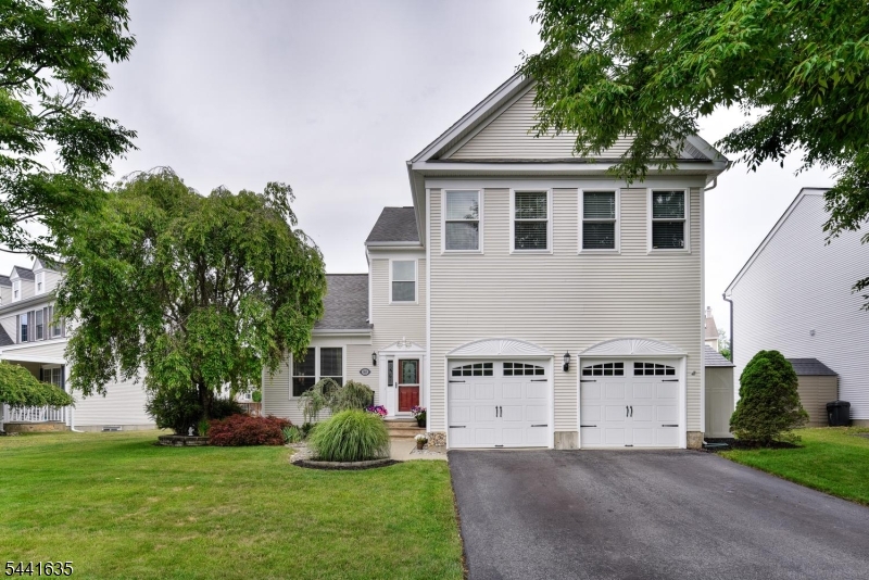 Welcome home to this beautifully maintained residence nestled in one of Hackettstown's most desirable communities. Ideally located just minutes from the charming downtown district, you'll enjoy convenient access to shopping, dining, entertainment, local theaters, NJ Transit, and Centenary University.  From the moment you enter, the impressive two-story foyer and abundance of natural light create a warm and inviting atmosphere. The thoughtfully designed open floor plan offers the perfect blend of comfort and functionality, featuring formal living and dining rooms ideal for everyday living and special gatherings. The spacious eat-in kitchen is appointed with granite countertops, a breakfast bar, and ample cabinetry, flowing seamlessly into the expansive family room. A sunroom just off the main living area provides the perfect place to relax while overlooking the private backyard. Step outside to the deck, ideal for outdoor entertaining, dining, or simply enjoying the peaceful surroundings.  The second level offers four generously sized bedrooms, including a spacious primary suite complete with a walk-in closet and private en-suite bath. The finished basement expands your living space with a recreation room, lounge area, and wet bar, creating the ultimate setting for entertaining guests, hosting game nights, or enjoying movie nights at home. Offering space, comfort, and a prime location, this exceptional property presents the perfect opportunity to enjoy all life amenities.