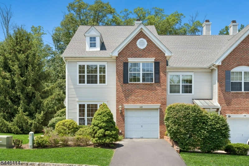 Absolutely beautiful 3-bedroom, 2.5-bath end-unit townhouse featuring a large finished walk-out basement. Freshly painted throughout, this home offers an open floor plan highlighted by a dramatic two-story family room filled with natural light. The spacious family room flows seamlessly into the kitchen, which features granite countertops, stainless steel appliances, and sliding glass doors leading to a large Trex deck perfect for relaxing or entertaining. A bright and inviting living room and formal dining room complete the first floor. Upstairs, you'll find three generously sized bedrooms filled with natural sunlight. The primary suite boasts a vaulted ceiling, two walk-in closets, and a private en-suite bathroom. A conveniently located second-floor laundry room adds to the home's functionality. The property backs to a large open lawn, followed by a wooded area, with the New Jersey National Golf Club beyond the trees, providing outstanding privacy and picturesque views year-round. Residents enjoy an unbeatable location within walking distance to top-rated schools, shopping, the community swimming pool, tennis courts, clubhouse, fitness center, and playground. Located in the highly acclaimed Basking Ridge School District, one of New Jersey's top-rated school systems, this home offers the perfect combination of comfort, convenience, and lifestyle.