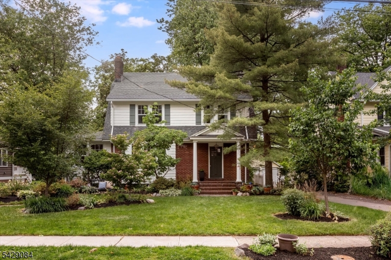 Set on a beloved block in Maplewood's coveted College Hill neighborhood, this cherished home is coming to market for the first time in over 50 years. Moments from the Village, NYC trains, parks, and schools, it offers the perfect blend of timeless character, modern flow, and community people move here for.  Surrounded by lush landscaping, this quintessential Side Hall Colonial feels warm, welcoming, and deeply special from the moment you arrive. Freshly painted inside and out with new light fixtures and hardware throughout, the home is move-in ready while still retaining all the character you crave. Inside, beautiful HW floors with ribbon inlay & thoughtful mid-century wood details create a home that feels both classic and effortlessly cool. The main level offers an airy, connected flow, ideal for everyday living and entertaining alike.  Upstairs are four spacious bedrooms & a sun-drenched hall bath with double vanity, while the third floor offers a charming room with full bath, equally suited as a primary retreat, or guest space.  The finished lower level adds flexibility for movie nights, workouts, play and game days. Outside, enjoy the large deck, abundant yard space, a detached two-car garage (future gar bar anyone?), and room to garden, gather, and unwind.  On Bowdoin, neighbors become lifelong friends and block parties become core memories. A rare opportunity to own a home that has been genuinely loved, beautifully maintained, and ready for its next chapter.
