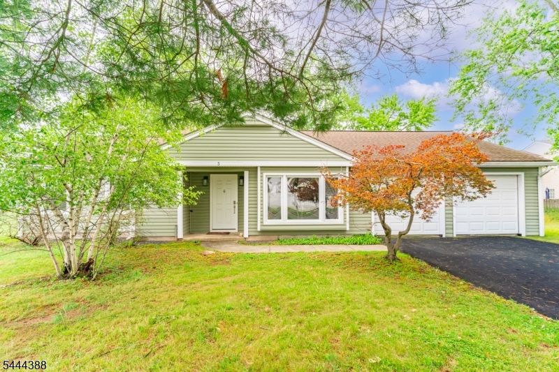 Well-maintained ranch-style home in Piscataway offers single-level living on a generous 98x197 lot. This 3-bedroom, 1.5-bath home features hardwood floors throughout the living, dining, and bedroom areas, with ceramic tile in the kitchen and bathrooms. A bright, open layout connects the living and dining spaces, leading out to a paver patio overlooking a large backyard. Solar panels provide energy efficiency and reduce utility costs. Conveniently located near major highways, Rutgers University, shopping, and dining.