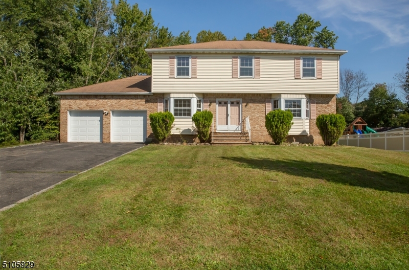 Welcome home to this stunning center hall colonial located in the heart of one of Morris County's most desirable towns, Parsippany Troy-Hills.  Conveniently located in close proximity to major highways, Route 80, 287, 280 and 10. Close to NYC and shopping malls.  As you enter through the tiled foyer, you are greeted with a Dining Room to your left and Living Room to your right. French doors from Living Room to Family Room. Brick wood-burning fireplace in Family  Room and hardwood floors throughout leave this home nothing short of perfection! Enjoy the fireplace through the open transition floor plan from Family Room to Kitchen. Kitchen complete w/ Granite countertops, full backsplash, Cherrywood cabinets and sliding glass doors to the deck.  Master Bedroom w/ Master Bath consists of a jetted tub, make-up vanity and sink vanity.  3 Generous sized room on 2nd level.  Walk up attic access on second level.  Partially finished basement.  DO NOT LET THIS PASS YOU BY!