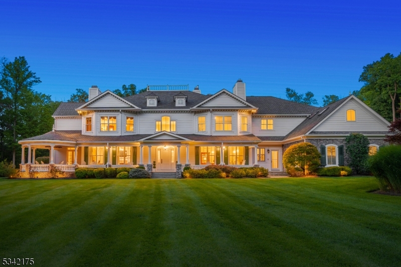 Arrive at the gated entrance & amble up the winding drive of this stately, 5-bedroom, 6.1 bath estate on 16+ acres, to experience the alluring grandeur of this home & the charming serenity of this splendid property. This pristine, 7,000+ sq/ft home has been completely updated w/ exquisite detail. Boasting a fully renovated gourmet kitchen & breakfast rm w/ custom marble FP, the 1st floor also features 3 additional FP's, a newly built Office w/ 3 walls of windows & extraordinary views to the private backyard, & a handsome Conservatory & Bar w/ rich mahogany furniture & multiple French doors. Climb the custom staircase from the 2-story foyer to the luxurious primary en suite, featuring a spacious bdrm w/ marble hearth FP, sitting rm, 2 custom designed WIC's & a bonus craft rm. Updated primary bath is appointed w/ tile plank flooring, soaking tub, custom tile shower & private commode. Two large bdrm en suites, 2 additional bdrms, 2 updated full baths & a 2nd laundry rm complete the 2nd floor. A beautifully finished lower- level w/ specialty tile flooring creates more exceptional space w/ a large ent / media rm, rec rm, exercise rm, & extensive storage & utility rms. W/ a breathtaking exterior consisting of Hardie-plank siding, an enormous bluestone porch w/ rotunda & a large paver patio w/ built-in FP & grill, this property allows you to commune w/ nature in a tranquil yet majestic setting. 800sqft heated salt-water pool & spa plans in final application stages with town.
