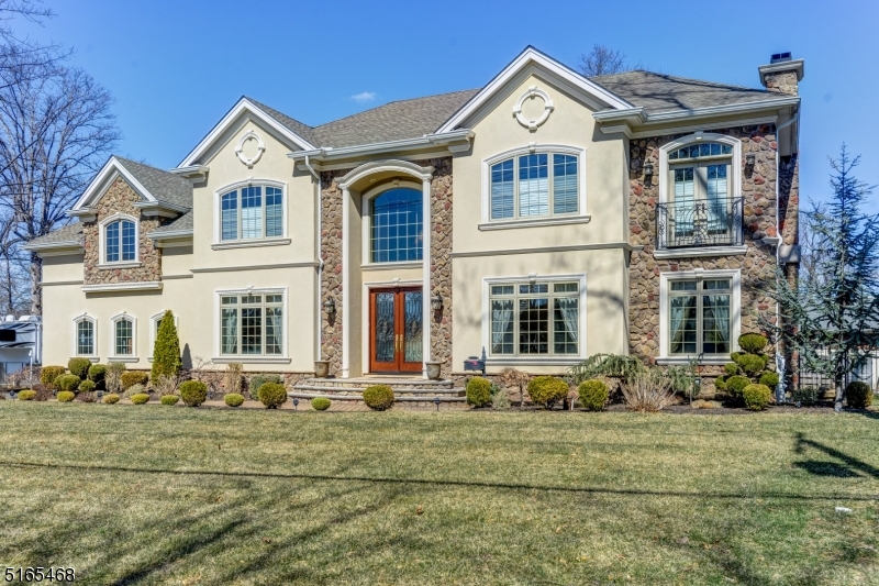 Costume Built, French Colonial, ENERGY STAR HOME, filled with pure elegance and grace. As you enter the 2 story majestic foyer you will adore the spectacular architectural design throughout. You'll appreciate the relaxed living style found in every room of this house. With lots of natural light, the easy flow of this open concept will bring you into a chef's grade kitchen, architectural limestone hood over a 48" Wolf 6 burner stove, pot filler, Sub Zero 48" refrigerator and wall ovens, warming drawer, Miele  full size and drawer style dishwashers and plumbed coffee bar, microwave oven, kitchen exhaust fan, wine cooler, washer and drier, whole house intercom system and water filter, central vacuum cleaner and PRIVATE WELL for free irrigation.