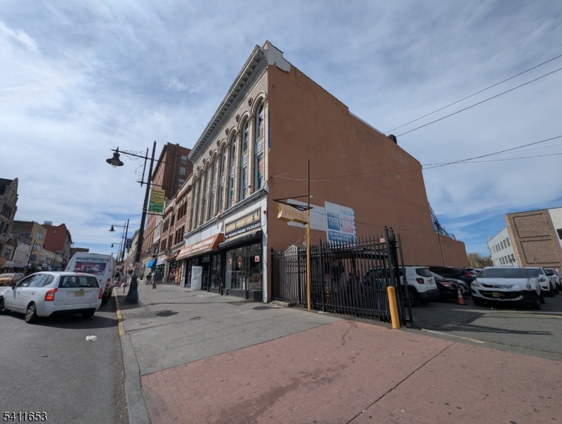 Prime income-producing commercial building in the heart of Paterson's Central Business District. Situated on highly trafficked Market Street, this 3-story masonry property offers approximately 13,107 SF of downtown real estate with immediate cash flow and significant upside potential. The first floor features a leased retail storefront (approx. 6,500 SF) and the third floor includes leased office space (approx. 3,500 SF), providing strong in-place income. The second floor (approx. 3,500 SF) offers clear value-add potential. The property also includes rear land behind the building, creating additional expansion or development opportunity (subject to municipal approvals). Zoned B-4 CBD, supporting a variety of commercial and mixed-use possibilities. Based on zoning parameters and preliminary concepts, there may be potential for residential conversion with conceptual estimates ranging from approximately 40"90 units, subject to architectural design and full city approvals. Buyer to perform independent due diligence. Excellent opportunity for investors, developers, or owner-users seeking cash flow with long-term growth potential.