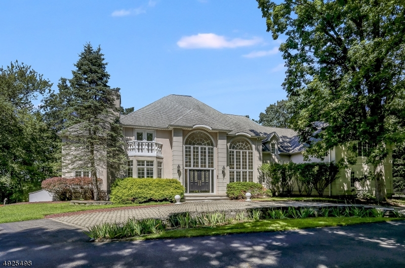 Unbelievable Views from this Gorgeous Custom Colonial.  Soaring Ceilings and Giant Windows front and back allow tons of natural light in.  1st Floor Master Suite with 2 walk in closets 3 Additional large bedrooms each with a walk in closet  Plus there is an approximately 1,000 square foot Bonus room on 2nd floor with private staircase & full  bath could be for maid quarters or in law suite.  4 Fireplaces  gas, wood, pellet, & gas starter located in Master Bedroom, Living room, Family room and Library.  Huge Deck overlooking the view.  3 Car garage attached w entrance to 1st floor.  Set on over 5 acres at the end of a cul-de-sac.  Partially finished basement with game room, potential exercise room, workshop and storage.Expansive home with room for everyone!.  Live in Privacy and Luxury.