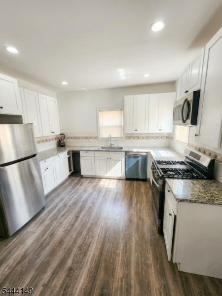 Discover the charm of this beautifully maintained Montclair two-family home! Each bright, spacious unit blends modern updates with classic character. Enjoy a finished basement with a bathroom, a finished third level, a two-car garage, a lovely yard, and proximity to Montclair's vibrant downtown. Perfect for owner-occupants or investors,don't miss this opportunity!