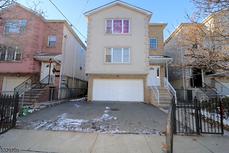 WELCOME!!!!! This is an amazing opportunity to own a well-maintained three-family home conveniently located in Newark's desirable Upper Roseville neighborhood. Enjoy an unbeatable location just steps from Bloomfield Avenue's shopping, restaurants, and everyday conveniences. Situated only a half block from Branch Brook Park and the Bloomfield Avenue Light Rail Station, this property offers an easy commute to NYC.Each spacious apartment features a kitchen, a bright living/dining room, three generously sized bedrooms, two full bathrooms, and the convenience of an in-unit laundry room. The exterior showcases an attractive brick and stucco front with low-maintenance vinyl siding, along with a two-car garage and a large backyard, providing ample parking and outdoor space.Whether you're looking to expand your investment portfolio or occupy one unit while generating rental income from the others, this exceptional multi-family property offers outstanding value, space, and location. Don't miss this incredible opportunity to own a versatile income-producing property in one of Newark's most convenient neighborhoods!