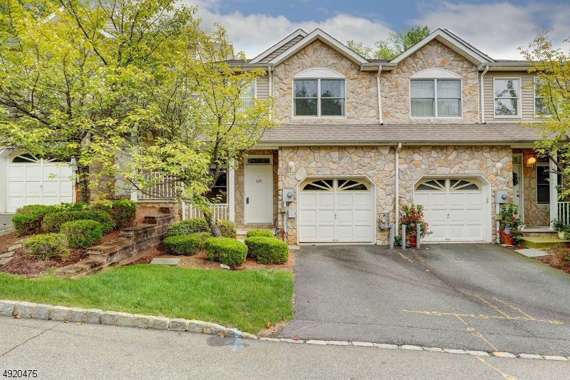 This Oak Model design is one of the most sought out models in one of Parsippany's most desirable neighborhoods!  Walk into this double story foyer with an open concept floor plan.  Bright and airy.  Hardwood floors downstairs with a fireplace and deck in the main Living Room.  Upstairs fully carpeted.  3 bedrooms, featuring a large master bedroom with large master bathroom and large walk-in closet.  This ideal location, while nestled in the mountain landscape of Morris County is also a commuter's dream - close to various NJ transit buses and trains, and all major highways, including Route 287, Route 46 and Route 10.  You are only 30 miles away from NYC!  Association pool and clubhouse.