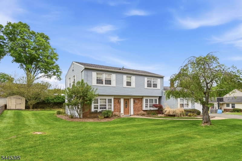 Welcome to this spacious and well-maintained 4-bedroom, 2.5-bath Colonial set on a beautiful, level property with plenty of room to enjoy both indoors and out. The inviting floor plan offers a bright living room, formal dining room, and an oversized family room featuring a cozy fireplace perfect for everyday living and entertaining. The eat-in kitchen provides ample cabinet and counter space with room for casual dining. Upstairs, you'll find four generously sized bedrooms, including a spacious primary suite with private bath. Additional highlights include an attached garage, hardwood floors in select rooms, abundant storage, and a large, flat backyard ideal for outdoor gatherings, play, or future expansion. Conveniently located near schools, parks, shopping, and transportation, this home offers incredible potential and the perfect opportunity to make it your own. NEW 4 BEDROOM SEPTIC BEING INSTALLED IN FRONT YARD!!