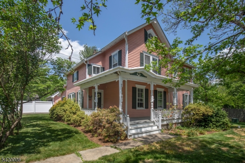 Step back in time with this timeless four bedroom home in the storybook setting of Pottersville. Surrounded by historic character, natural beauty, and a peaceful small-town feel, this special property is just moments from the charming town center, the Black River, and nearby Hacklebarney State Park. Inside, warm and inviting spaces are filled with natural light, highlighting the character and comfortable flow of the home. A first floor primary suite with full bath and a walk-in closet adds convenience and flexibility, while the main level also features a half bath, spacious living room with fireplace, formal dining room, inviting den with built-ins, updated kitchen, office, and mudroom. Upstairs, additional bedrooms and baths provide ample room for guests, hobbies, or work-from-home needs. Outside, the beauty continues with lovely garden beds and a welcoming stone patio, ideal for outdoor dining, entertaining, or quiet morning coffee. Home has a built-in generator. This truly special setting offers the charm of Pottersville living while remaining minutes from shopping, trains, highways, and access to New York City. A wonderful place to call home.