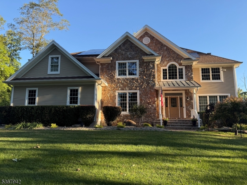 20 year-young beautifully built custom home with distinctive floor plan and clever features that set it apart from the rest. Fine details throughout including custom millwork, tray ceilings, wood and tile flooring, recessed lighting, open 2nd floor with bridge and den overlooking light-filled 2-story family room w/floor to ceiling windows and stone fireplace, large kitchen with cherry cabinets, granite counter tops, stainless steel appliances, bi-level center island w/separate prep space and bar for seating, desk area w/filing drawers, bumped out breakfast nook overlooks tree-lined yard, primary suite w/sitting area and full bath; 3 additional bedrooms, 1 with en suite bath; walk-up attic could be finished for added living space; unfinished basement w/2nd staircase to garage/outside access. Oversized 3 car garage with work area and sink. Private setting on cul de sac. Public utilities, gutter guards, paver walkways, fully fenced yard, whole house automatic generator, newer hot water heater and so much more.  Cucinella elementary and West Morris Central High School.