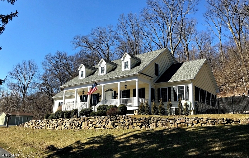 Welcome home! This distinctive colonial with elegant simplicity and timeless appeal will make you feel like you stepped into the pages of House Beautiful. Finely detail interior with custom millwork including crown molding, picture frame wainscoting, built-in bookcases; French doors; wood floors; two-sided gas fireplace; gorgeous gourmet kitchen with high-end stainless appliances to release your inner chef; 4 good-sized bedrooms including the Master with fully outfitted closet to make you swoon and full bath with walk-in shower; main bath with jetted tub and dual vanity; formal dining room; home office/den; full basement, attic and much more. Private fenced backyard with paver patio, hot tub, terraced planting beds, koi pond. Less than half mile to Route 206. Minutes to Historic Chester. A dream home!