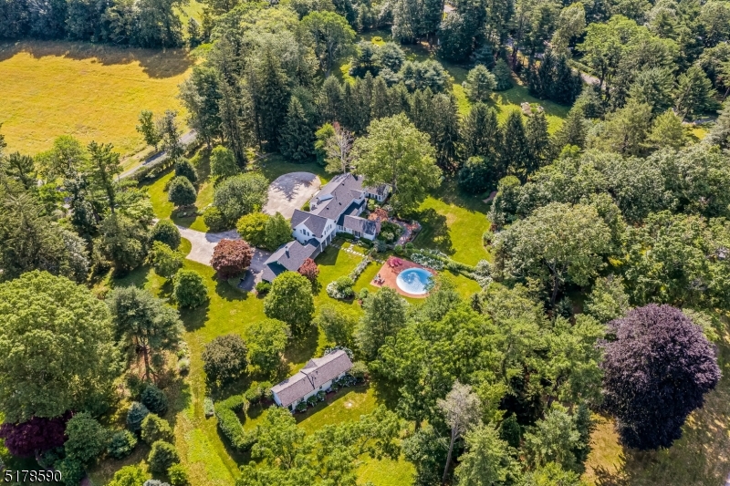 Stunning custom home privately set on 7 +/- acres in sought after mountain location. Exceptional grounds with fabulous gardens, terraces, pool and a charming 1 Bedroom cottage with living Room, kitchen and full bath.