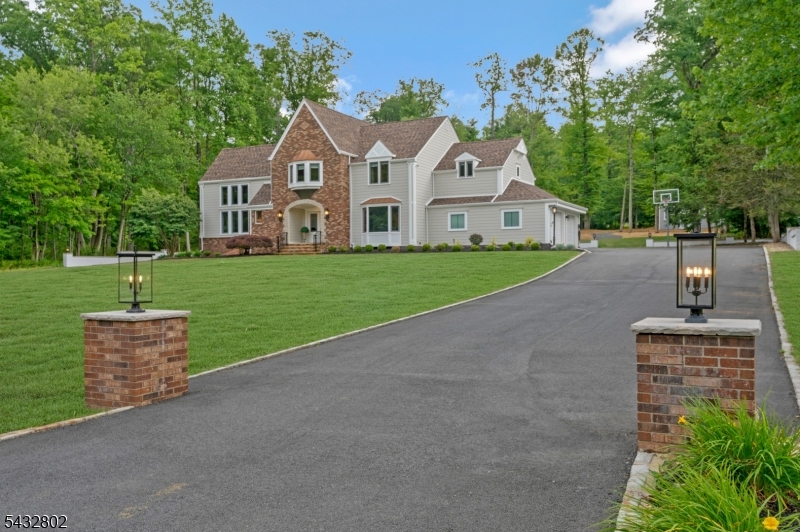 Nestled on 1.27 beautifully landscaped acres at the end of a cul-de-sac, this completely updated Colonial offers exceptional space, comfort, and timeless appeal! Renovated throughout, the home features a new roof (2026), new HVAC system (2026), 3 newly renovated baths (2025), and Hardie Plank siding on all four sides. Welcoming open floor plan showcases oversized rooms, soaring ceilings & hardwood floors thru-out 1st & 2nd floors! Dramatic LR features a 2-story ceiling, walls of windows & full wet bar complete w/ an ice maker, bar refrigerator, and sink perfect for entertaining. FR offers a stone gas fireplace & sliding doors that open to a spacious paver patio overlooking the private backyard. Large eat-in kitchen includes ss appliances, generous workspace & French door leading outdoors. Formal DR w/ bay window, powder room, laundry/mud room & access to the 2-car garage complete main level. Upstairs, you'll enjoy 4 spacious BRs & 3 brand new full baths...incl. primary suite w/ renovated BA, large walk in closet, dressing room/office & 2nd W/D, Ensuite BR w/ its own brand new bath & renovated hall bath. Loft provides ideal space for a reading nook. Finished lower level adds tremendous flexibility w/ 3 add'l rooms & full bath, ideal for rec, hobbies, guests or work-from-home needs. Add'l highlights: custom lighting, abundant built-in closet storage, electric vehicle charger, new 12' x 10' shed w/ electricity, mature landscaping & convenient location just minutes from Route 78.