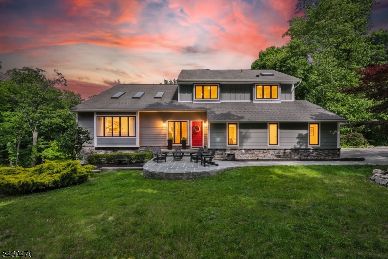 Nestled on nearly 2 private acres within the prestigious gated community of Smoke Rise, this exceptional custom residence showcases luxury, craftsmanship, and meticulous attention to detail throughout. This 4-bedroom, 3.1-bath home seamlessly blends timeless design with modern comfort. Extensively renovated with uncompromising quality, it features premium Hardie siding, expansive two-level Trex decking, radiant-heated floors in the primary bath, vaulted ceilings, custom millwork, professionally curated finishes, and beautifully landscaped grounds. Every improvement has been thoughtfully executed, creating a truly turnkey luxury residence. Designed for both entertaining and everyday living, the home is filled with natural light and offers exceptional flexibility. The walkout lower level features soaring 12-foot ceilings, direct access to the outdoor living areas, a private office or flex room, and a separate en-suite guest suite ideal for a fifth bedroom suite. Additional highlights include a custom garage with built-in cabinetry, epoxy flooring, and cathedral ceilings with ample height for a vehicle lift. Surrounded by the privacy, security, and natural beauty that define Smoke Rise, this one-of-a-kind residence offers a rare opportunity to own a meticulously updated home where luxury, functionality, and lifestyle come together effortlessly.