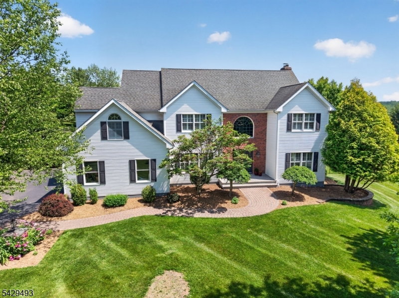 Welcome to this beautiful 4-bedroom, 2.5-bath home set on 1.61 scenic acres in highly desirable Wellington West neighborhood of Union Township. Built by top-quality Brinkerhoff homes, this exceptional property offers timeless craftsmanship, stylish updates & a warm, inviting layout for everyday living & entertaining. The beautifully renovated & expanded chef's kitchen features top-of-the-line stainless steel appliances, abundant cabinetry, generous prep space & a spacious eat-in area. The main level also includes first-floor laundry, mudroom, & comfortable living spaces that flow easily to the outdoors. French doors open to a beautiful back deck overlooking a private, lush, fully fenced yard with gorgeous plantings, mature landscaping, & a fire pit   the perfect place to relax, entertain, & enjoy this special setting. Upstairs offers 4 generously sized bedrooms, including a lovely primary suite with a beautifully renovated four-piece bath. Additional updated baths add to the move-in-ready appeal. The basement provides opportunity space for a gym, media room, playroom, office, or storage. You will love the privacy this property offers in one of the most sought after communities! Minutes to Round Valley Reservoir, top-rated Union Township schools, North Hunterdon High School, Routes 78, 31, 22, & 287, plus nearby express bus service to NYC. A perfect blend of quality construction, thoughtful updates, privacy, & location - this Wellington West home truly has it all.