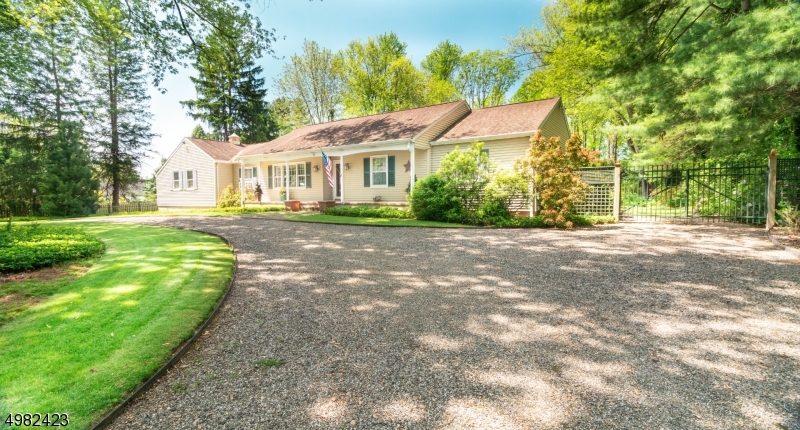 Fabulous one floor living on an exquisite 1 acre lot just minutes from NYC train. You can have it all. Well maintained 4 bedroom, 2.1 bath home with formal living room & dining room. Hardwood floors, spacious eat-in kitchen with sliders to the oversized deck, family room with fireplace & built-ins. Spacious first floor master suite with walk-in closet & private bath. 3 additional bedrooms, 1 used as an office, fenced backyard with specimen trees & landscaping.