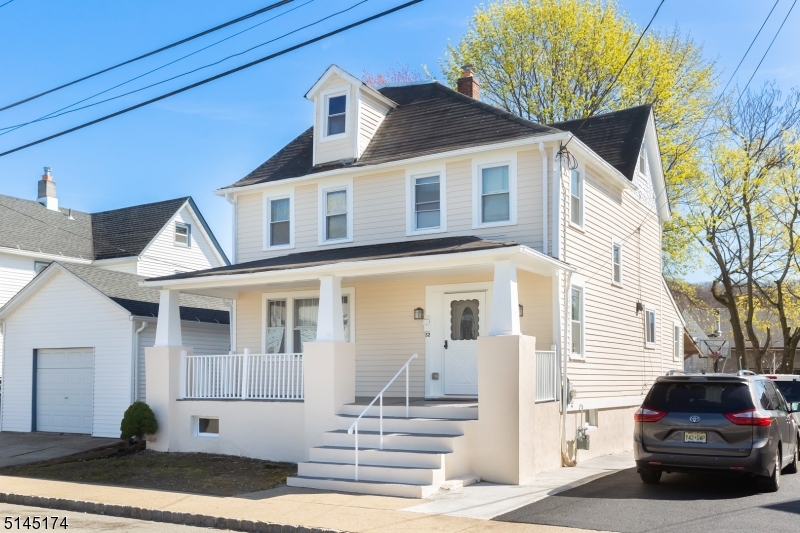 Freshly painted exterior and new driveway are a few of the enhancements! Open air porch perfect for that rocking chair.  Walk into character and well maintained home. Newer bathroom, hardwood floors on main level. Great open space and plenty of parking.