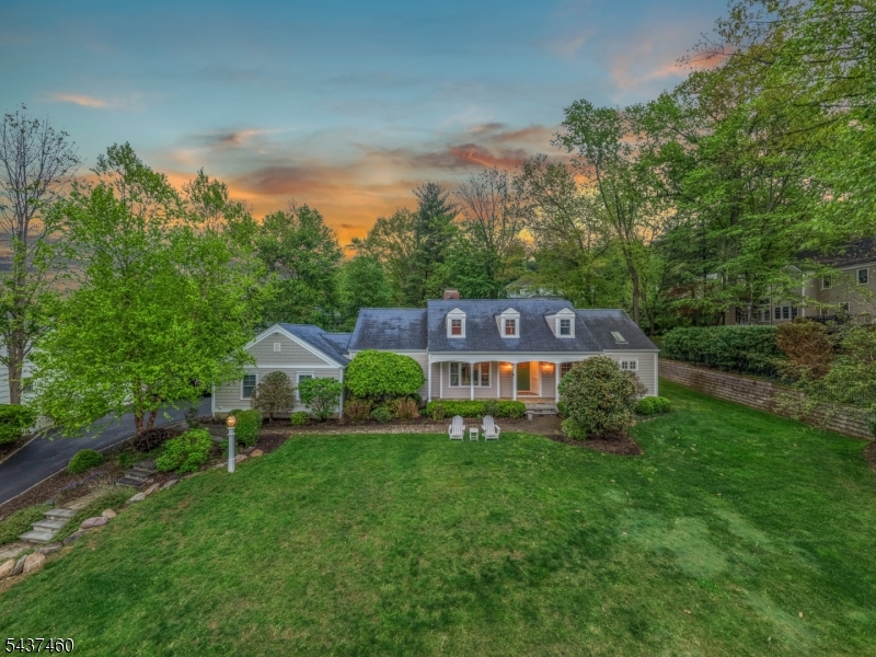 GORGEOUS EXPANDED 5-BDRM CAPE IN CHATHAM TWP'S COVETED WICKHAM WOODS. Excellent curb appeal. Gracious, modern floorplan offering ideal blend of places to gather or to escape for quiet/work. Generous, light-filled Living Room opens to large Dining Room, perfect for hosting. Eat-in Chef's Kitchen has it all"high-end s/s appliances (Miele, Smeg), stunning slate tile floors, expansive Center Island w/seating, copper prep sink & granite countertop, crisp white wood cabinetry w/ butcher block perimeter countertops. Opens to Covered Deck w/ charming beadboard ceiling ideal for sipping morning coffee, reading, or keeping an eye on Back Yard play. Relax in Family Room boasting fireplace w/ marble surround, built-in shelving/cabinetry, big Windows. Spacious first-floor Primary Suite is true retreat w/ 2 Large Closets, lots of light & Full Bath w/ extra-long vanity, Steam Shower, soaking tub, 2 Large Linen Closets & Skylight. Upstairs find 3 massive bedrooms, cheery Full Hall Bath w/ tub/shower. Sprawling, beautiful & recently refreshed Lower Level has lots of options for work or play, inc. large Rec Room, Home Office, large Full Bath w/ Shower, Home Gym, large Laundry Room w/ Elfa Shelving wrapping 2 walls. Oversize 2-Car Garage w/ eclectic charger & more Elfa shelving. Large yard w/ manicured lawn & landscaping. Social, neighborhood well-known for block parties/events minutes to town, NYC train, hwys. Top-ranked Chatham Schools. 111 Westminster is why you move to the suburbs!