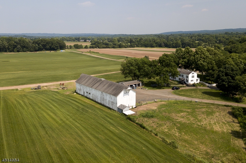 Here is a once in a lifetime chance to purchase one of Montgomery's few remaining large-acreage farm sites in the heart of Skillman, only 5 miles to downtown Princeton! Surrounded by Skillman Park, Hunter Farm show grounds and directly across from award-winning Montgomery High School, it's time to live the dream of being a gentleman farmer. Two sub-divided parcels allow for two residential home sites plus outbuildings. A Norman Rockwell-style farmhouse and a large barn exist on the property and add to the all-around Americana flavor with a rich local history dating back to the 1800s. A 400-foot well services the underground irrigation system carrying water to most of the farm. This is a never-to-be-repeated opportunity! . Farm orientation faces North!