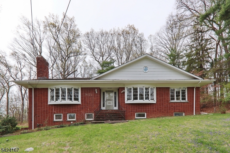 An exceptional opportunity to create your dream home from a true blank canvas. This property has been fully prepped and is ready for your vision no demolition required. The heavy lifting has already been done, allowing you to focus on design and finishes tailored to your style. This brick raised ranch offers 5 bedrooms, including 2 on the main level, 2 framed on the second floor, and 1 on the ground level. There are 3 bathrooms ready to be completed, plus the potential for 2 additional baths on the second floor.The main level features hardwood floors, a spacious kitchen area with a separate, sun-filled dining space highlighted by wall-to-wall windows, and two wood-burning fireplaces. The second floor is framed for two bedrooms with private baths, along with a bonus space ideal for a home office or additional living area. There is also the potential for a larger expansion should you desire.  The ground level offers a large, versatile flex space perfect for a family room, recreation area, or whatever suits your needs, along with a bedroom, bathroom, oversized laundry room, and ample storage. Walk-out access adds convenience and functionality. Situated on an expansive 0.827-acre lot, the property also includes bay windows in both the living room and dining area, bringing in abundant natural light.