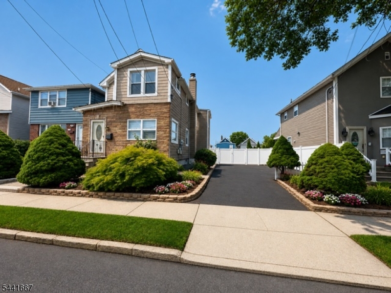 Excellent investment or owner-occupied opportunity! This well-maintained 2-family home sits on an oversized 50' x 100' lot (0.11 acres) in Kearny's desirable R-2 Zone and offers parking for up to 10 vehicles. Both units feature separate utilities, central air conditioning, forced hot air heat, hardwood floors, spacious living rooms, eat-in kitchens, 2 bedrooms, and 1 full bathroom.The full basement provides a laundry area, utility room, storage space, and access to the mechanicals, including HVAC systems. Whether you're looking to generate rental income, occupy one unit while renting the other, or explore future possibilities, this property offers exceptional flexibility and value. Conveniently located near schools, parks, shopping, transportation, and close to NJ TURNPIKE