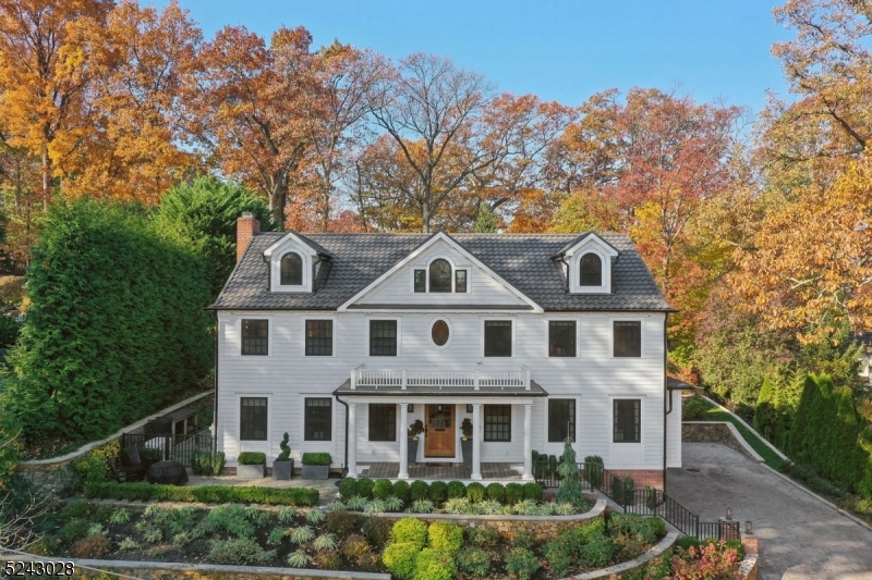 NEW TO MARKET-ABSOLUTELY STUNNING 5/6BR, 6 1/2BA Colonial in a sought-after Franklin Elementary School neighborhood. No expense was spared throughout a complete gut renovation to this exceptional home. The floorplan was carefully designed to capture the ultimate in a comfortable day-to-day living and entertaining. An expansive foyer continues to a large Living/Family RM w/FP, then a cozy Sunroom. A gorgeous all customized gourmet kitchen, breakfast area, and pantry/mudroom is truly perfect. The dining room is fitted with hickory built-ins and opens to a second family room w/gas fireplace and fully equipped bar: 2 ref/freezers, sink & more custom built-ins. On the second floor there is a LUXE Primary Suite w/private balcony, 4 additional bedrooms, all en suite, and a laundry room.  A surprise awaits on the third floor, an amazing Bonus family room w/gas fireplace, fully equipped bar, built-in guest bed alcove and an OFC/6th BR w/Full bath.  The lower level with a Rec Rm, Full Bath, second laundry and access to the fully finished, heated & cooled 3 1/2 car garage with car washing station are a wow! The rear patio is staycation living w/a huge heated patio, fire pit, hot tub, full outdoor kitchen w/ smoker all set with privacy in mind, beautifully landscaped throughout.  Beautiful tiered walls, thoughtful landscape & hardscape design, heated paver block driveway. Truly a spectacular and must be seen to appreciate the countless amenities.