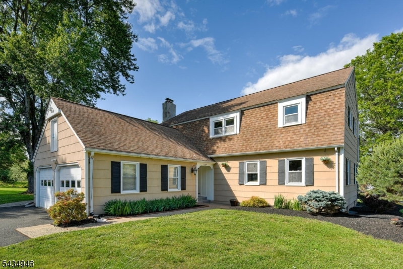 Welcome to this beautifully maintained Colonial, ideally situated in a wonderful neighborhood on the desirable north side of Route 22. offering 5 bedrooms and 3 full baths. The main level showcases hardwood floors, a spacious den with a cozy fireplace, and a large eat-in kitchen complete remodel with stainless steel appliances. A bright and inviting four-season room provides additional living space year-round and overlooks the backyard perfect for relaxing or entertaining. Convenience meets versatility with a full bath on the first floor. Current owner created a 5th bedroom off the kitchen which can easily be transformed back into the dining room.  Upstairs, the generously sized primary suite features an updated full bath, while three additional bedrooms share a beautifully renovated hall bathroom. Each bedroom offers ample space and storage. With tons of storage throughout, upgraded kitchens and baths, and custom woodwork details, this move-in ready home combines timeless Colonial style with modern comfort all conveniently located near schools, shopping, parks, and major commuter routes.
