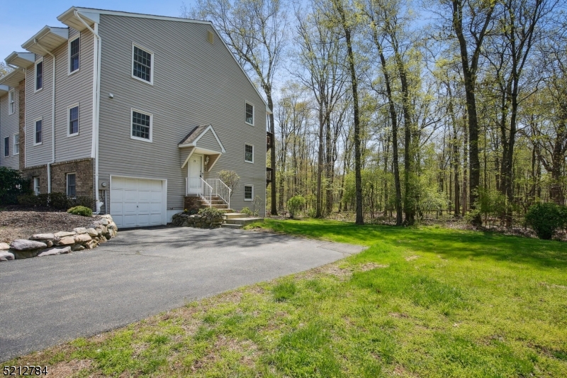 Welcome home to this private end unit in the desirable Brookstone community of Parsippany-Troy Hills. With spacious rooms and plenty of storage throughout, it combines the serenity of a quiet enclave with close proximity to shopping, dining, major roads and a direct train to NYC. Tucked in a quiet corner in the back of the development, this lovingly maintained unit offers plenty of privacy and lots of natural light.  The open-concept living/dining combo on the first floor features an expansive living area with access to a private balcony and a generous formal dining space. Quartz countertops and a walk-in pantry complete a charming eat-in kitchen. Upstairs, two en-suite full baths compliment the bedrooms. A sitting room with access to an upper balcony in one bedroom and a windowed walk-in closet in the other add their own comforts to each room. An additional bedroom on the ground level offers access to a patio and makes for a perfect flex space for whatever you may need, be it another bedroom, office, excercise or recreation room. Comfortable and move-in ready, all you will need to do is unpack!