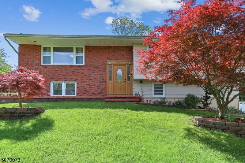 This beautiful home is situated atop a grassy knoll in a neighborhood with sidewalks and curbing all around. Numerous attractive updates, loads of natural light, and an open floor plan make it a must-see.  There is a large, fenced backyard with Trex deck and patio, plus plenty of extra parking in the driveway.  The property is centrally located near shopping, commuting options, and major highways.  Enjoy all the amenities and programs Wayne has to offer! Owner currently pays private flood insurance for approx $1k/yr.