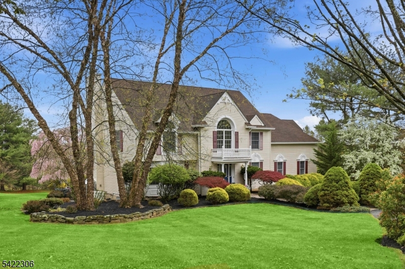Gorgeous property including perennials, mature pine trees, flowering trees, gazebo, small goldfish pond, decks and patios surround this fantastic Squire Hill custom colonial home, lovingly cared for by its owner of over 25 years.  Step inside a two-story welcoming foyer with split staircase and see formal living room, formal dining room and spacious, functional center island kitchen wtih huge breakfast area.  Kitchen is open to spacious family room with wood-burning fireplace, as well as 3 season room with freestanding propane gas fireplace, ceramic tile floor and skylights.  Powder room, laundry room and access to attached 2 car garage complete the first floor of living space.  Second floor has double door entry leading to primary suite with large sitting room area, two walk-in closets and full bath with jetted tub and stall shower.  Three additional bedrooms, including one with balcony and mail bath with double vanity round out the second floor.  Unfinished basement with high ceilings, 10 year-old roof, blinds, central air, automatic propane generator are just some of the desirable traits this home offers it's new owner.  Washington Twp. schools and West Morris Central High School with IB program offer the best in public education!  Fireplaces as-is with no known issues.  Septic recently inspected.